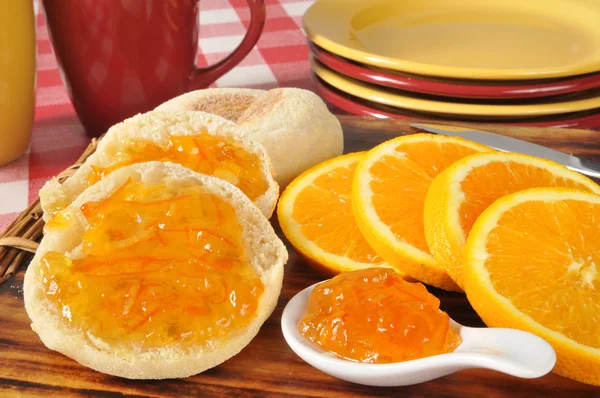 Orange marmalade on an English muffin — Stock Photo, Image