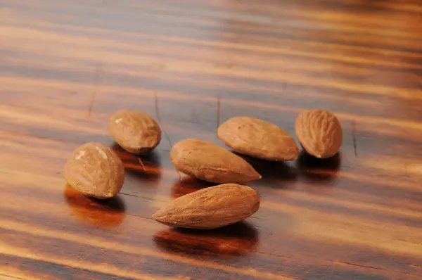 Almonds on a cutting board — Stock Photo, Image