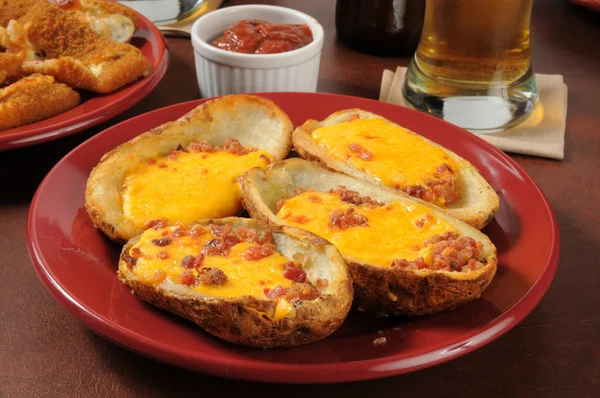 Potato skins with bacon and cheese — Stock Photo, Image