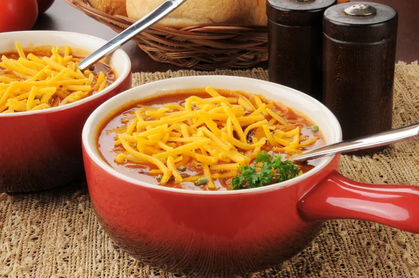 Chili con carne topped with cheese — Stock Photo, Image