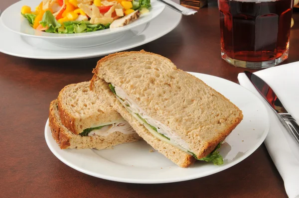 Turkey and swiss sandwich with a salad — Stock Photo, Image