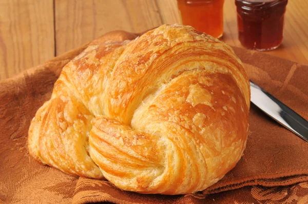 Golden croissant — Stock Photo, Image