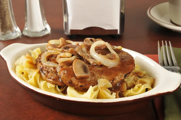 Salisbury steak on noodles — Stock Photo, Image