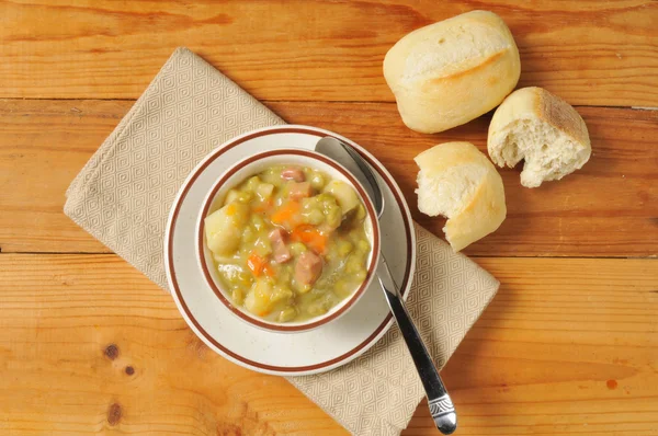 Split pea soup and rolls — Stock Photo, Image