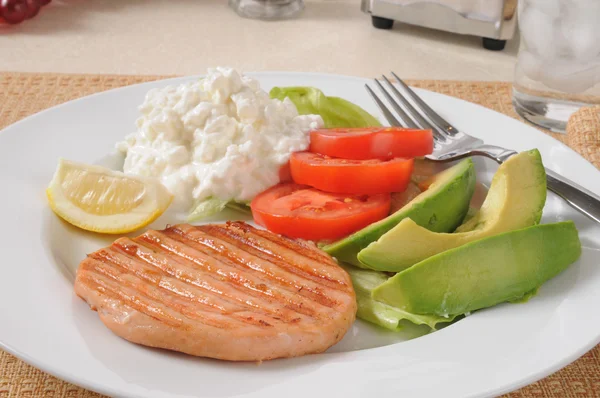 Salmon patty with avocado — Stock Photo, Image