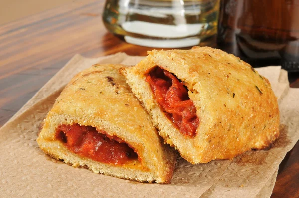 Pizza pockets and beer — Stock Photo, Image