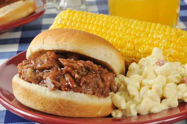 Barbecue beef sandwich with corn on the cob — Stock Photo, Image