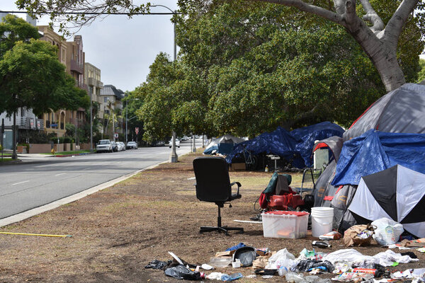Beverly Hills, CA USA - October 22, 2021: Homeless encampment in Beverly Hills on Burton Way in front off luxury apartment buildings