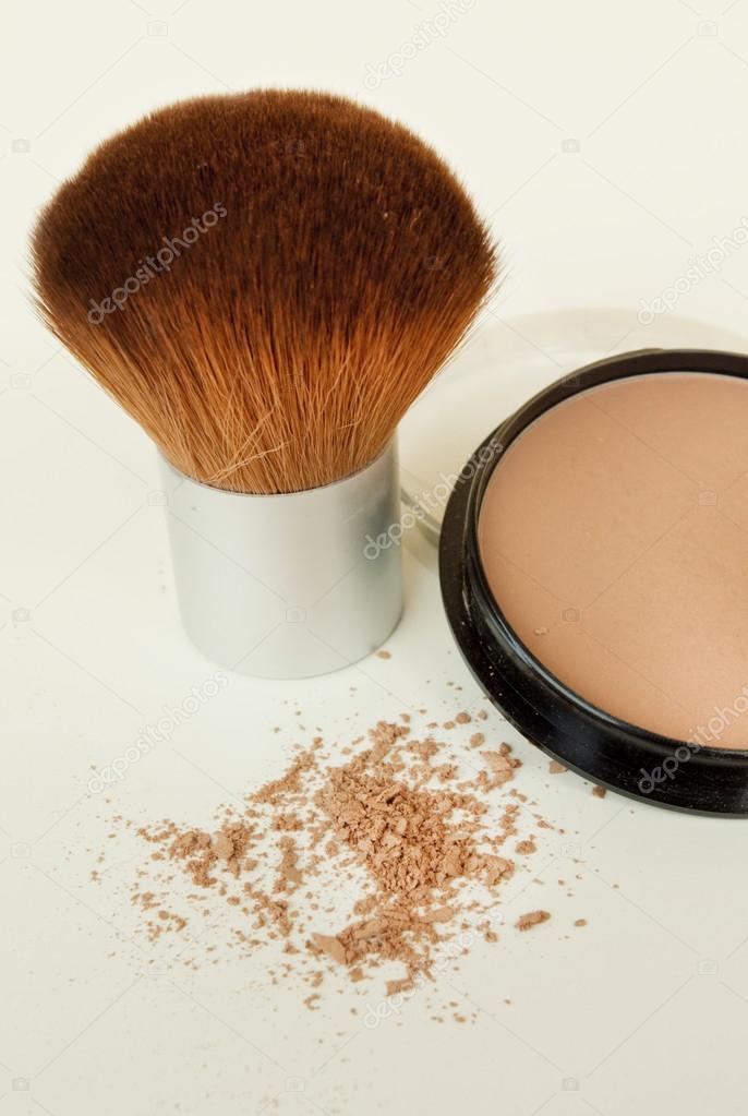 Makeup brush and powder isolated