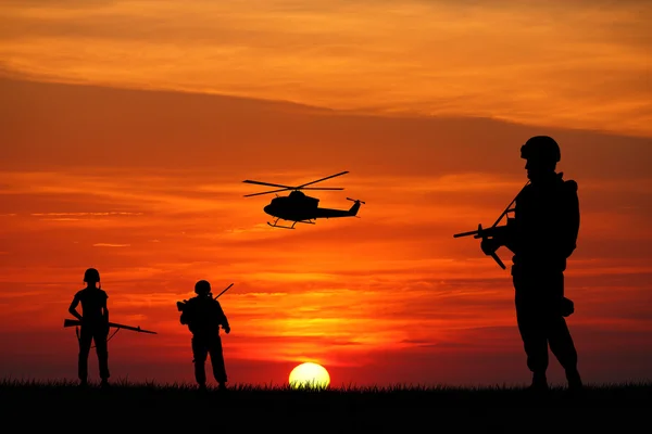 Soldiers at sunset — Stock Photo, Image