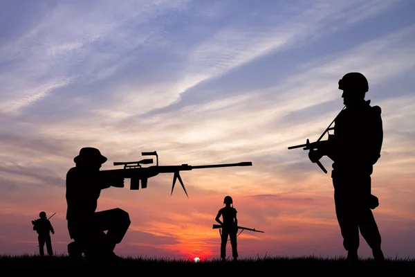 Soldiers at sunset — Stock Photo, Image