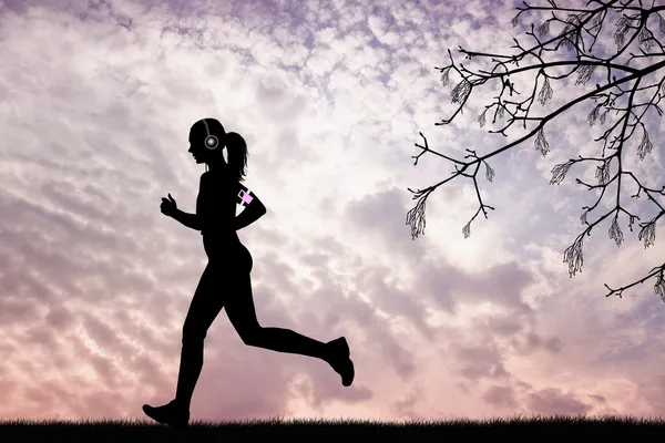 Girl runs with music player — Stock Photo, Image