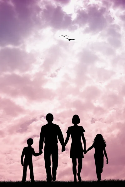 Семья на закате — стоковое фото