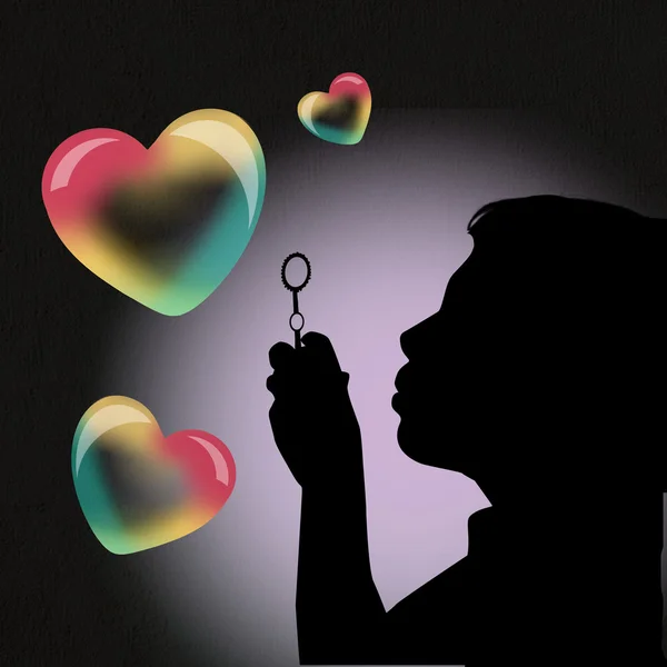 Девушка делает мыльные пузыри в форме сердца — стоковое фото