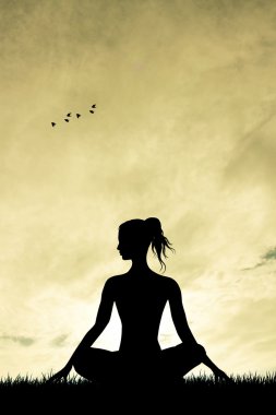 Gün batımında Yoga