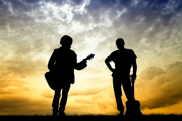 日没時のギタリスト — ストック写真