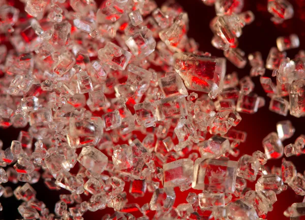 Crystals on a red background. Extreme closeup. Macro — Stock Photo, Image