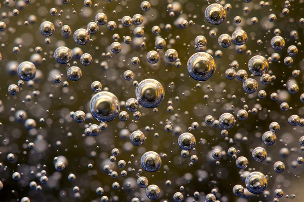 Achtergrond. bubbels in een vloeistof. macro — Stockfoto