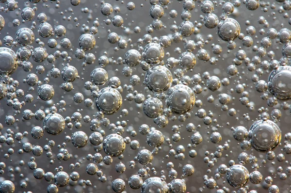 Achtergrond. bubbels in een vloeistof. macro — Stockfoto