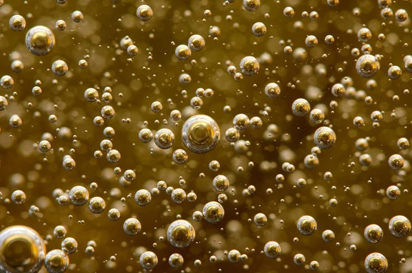 Achtergrond. bubbels in een vloeistof. macro — Stockfoto