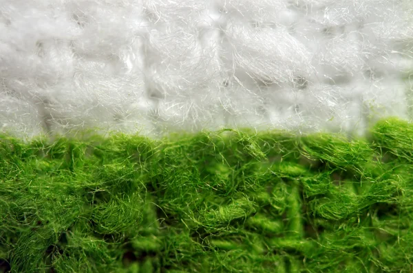 Es blanco el fondo verde de la tela. Macro — Foto de Stock