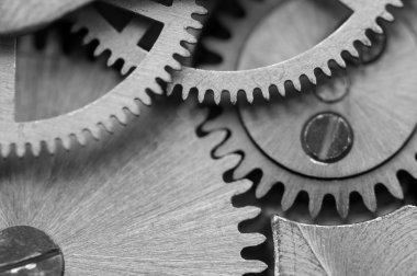 siyah beyaz arka plan ile metal cogwheels bir saat gibi. Makro