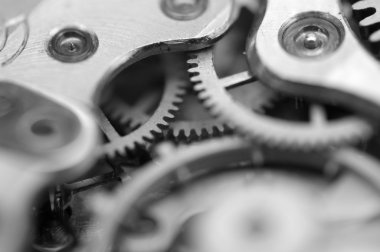Metal cogwheels bir saat mekanizması ile siyah beyaz Metalik arka plan