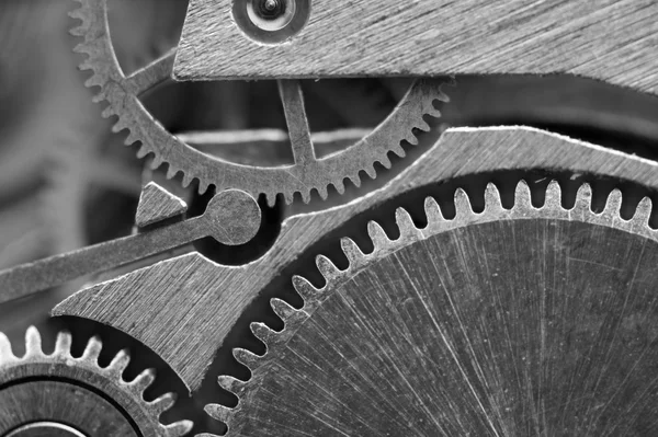 Arrière-plan avec roues dentées en métal une horloge. Macro — Photo