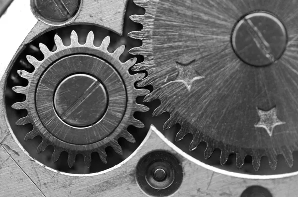 Черно-белый металлический фон с металлическими зубчатыми колесами часовой механизм — стоковое фото