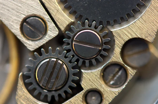 Metallic Background with metal cogwheels a clockwork. Macro — Stock Photo, Image