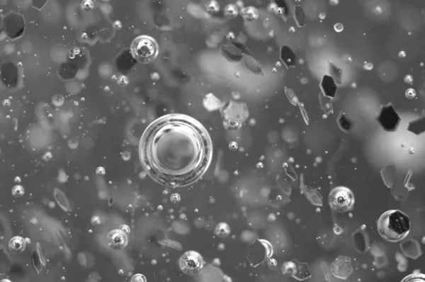 Luftblasen in einer Flüssigkeit. abstrakter schwarz-weißer Hintergrund — Stockfoto