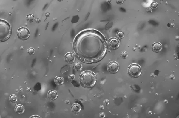 Air bubbles in a liquid. Abstract black-and-white background. — Stock Photo, Image