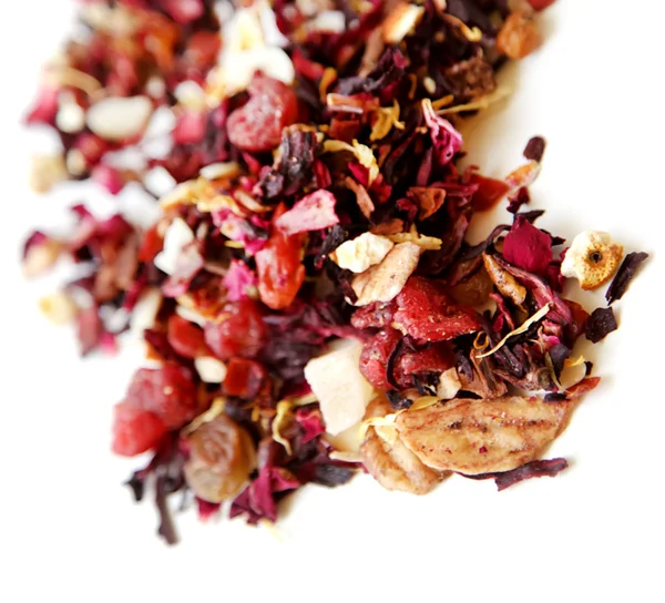 Aromatiska torr te med frukt och kronblad Stockfoto