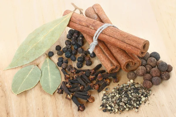 A set of spices on wooden cutting board closeup — Stock Photo, Image