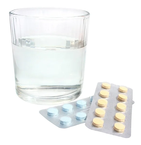 Glass and pills — Stock Photo, Image