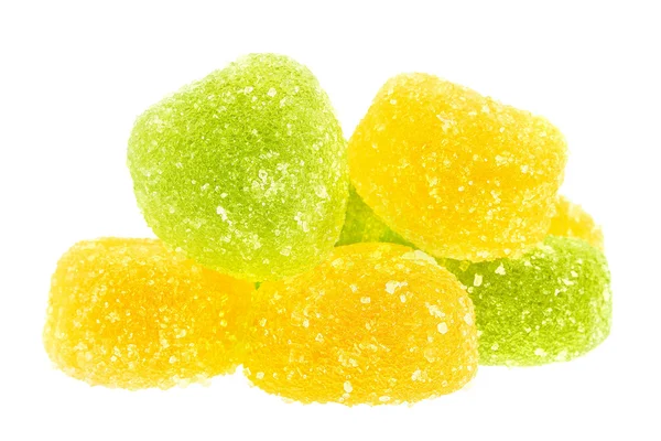 Egy marék zöld és sárga candy közelről elszigetelt — Stock Fotó