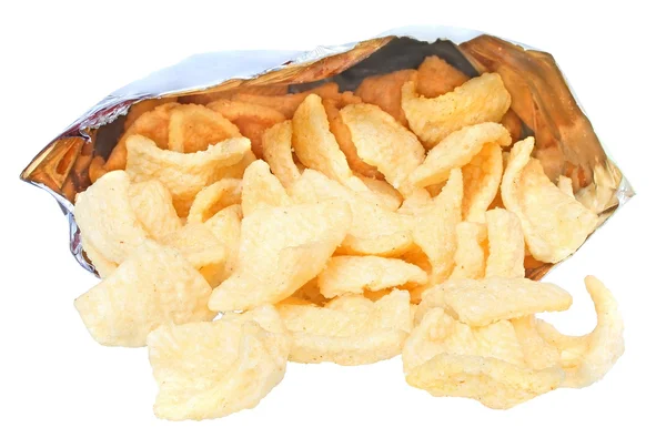 Potato chips spill out of the package — Stock Photo, Image