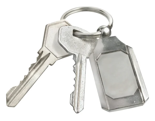 Two keys and trinket Royalty Free Stock Images