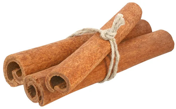 Three cinnamon sticks tied with a rope Stock Photo