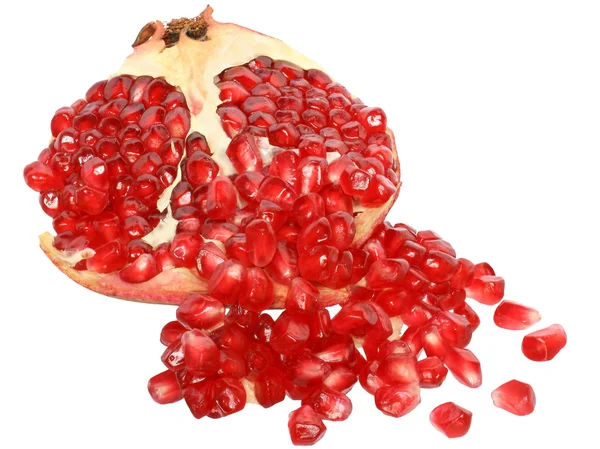 Cut the pomegranate with scattered grain — Stock Photo, Image
