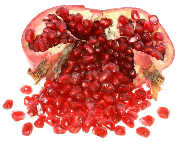 Cut the pomegranate with scattered grain. — Stock Photo, Image