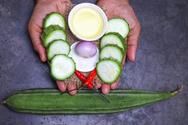 Ridges Gourd stock with spice on hand for cooking