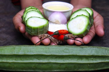 Ridges Gourd stock with spice on hand for cooking