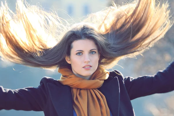 Beautiful model with long hair in motion — Stock Photo, Image