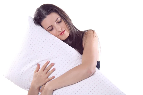 Beautiful girl embraces her pillow — Stock Photo, Image