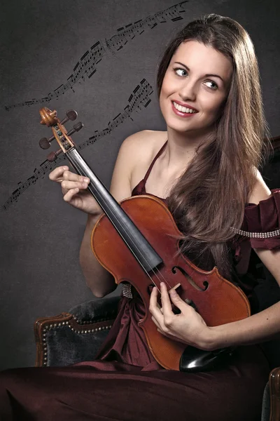 Funny and beautiful violin musician with music notes — Stock Photo, Image