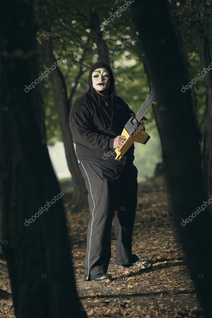 Creepy serial killer with chainsaw Stock Photo by ©Captblack76 31236503