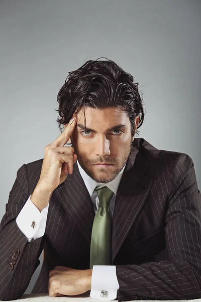 Handsome businessman with pensive expression — Stock Photo, Image