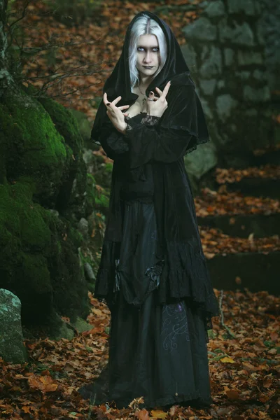 Dark witch posing in the woods — Stock Photo, Image