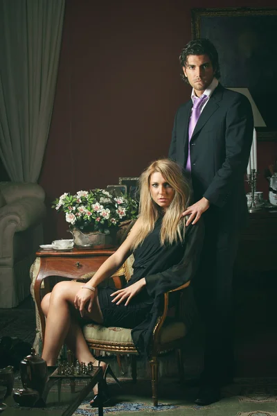 Portrait of a fashion couple in elegant house — Stock Photo, Image